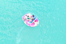 Couple enjoying a quiet ride on a solar-powered GoBoat in Antigua