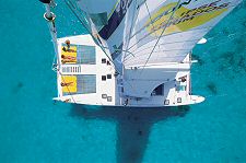Tropical Adventures, Antigua Tours and Excursions: The Mystic Catamaran private charter floating on the blue sea